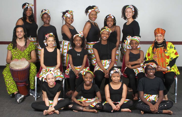 A group of African drumming students