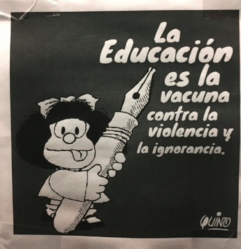 poster in Spanish that translates to "Education is the vaccine against violence and ignorance"