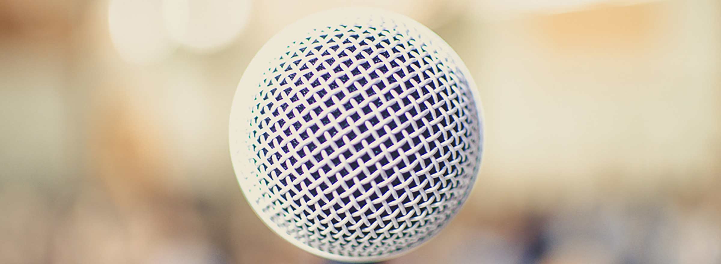 a close-up view of a microphone symbolizing social impact technology panels at sxsw