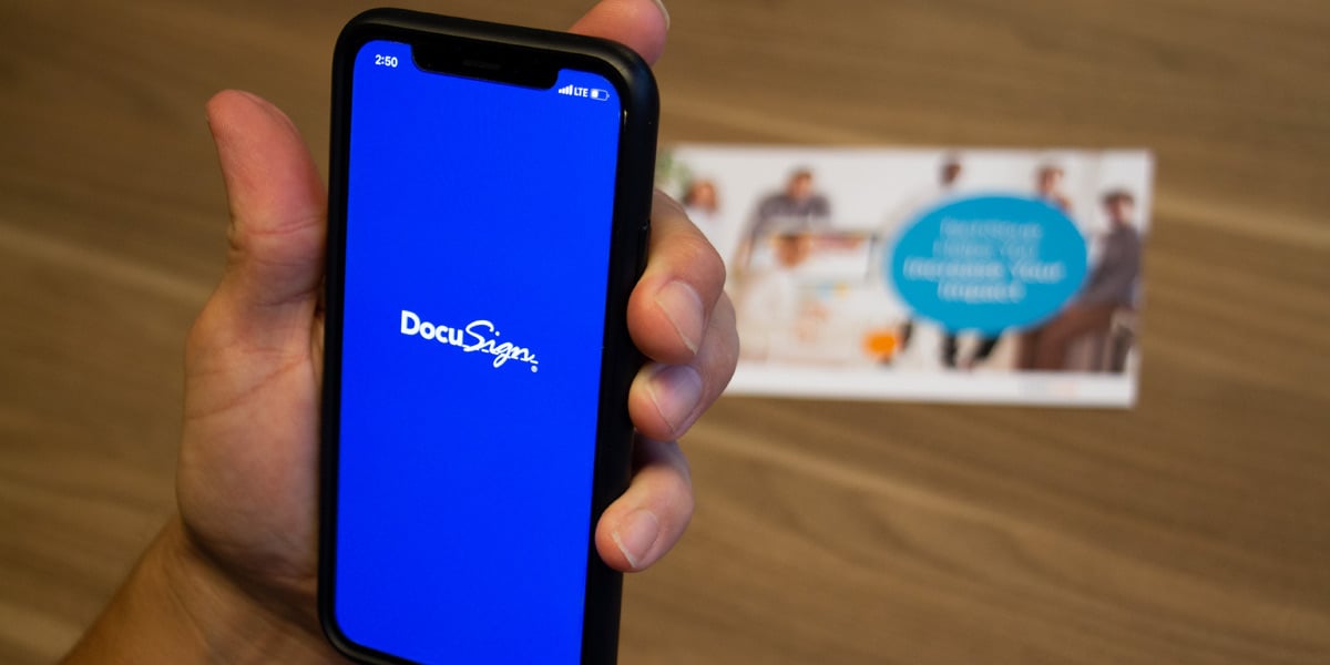 nonprofit staffer logging on to docusign from his mobile phone to complete e-signatures
