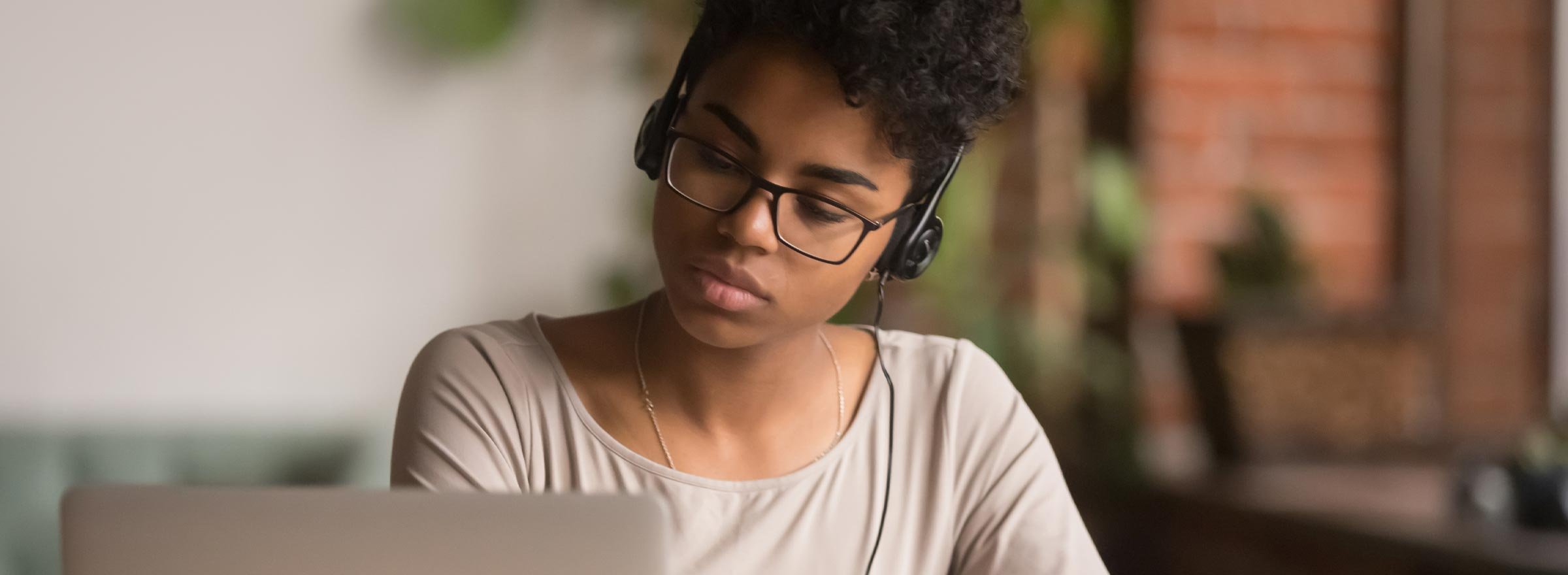 Photo of a woman working at a laptop