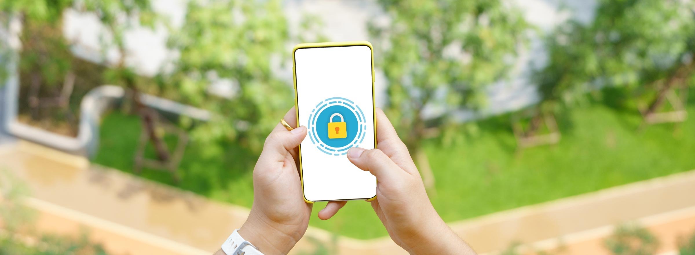 hands holding a smartphone showing a padlock on its screen
