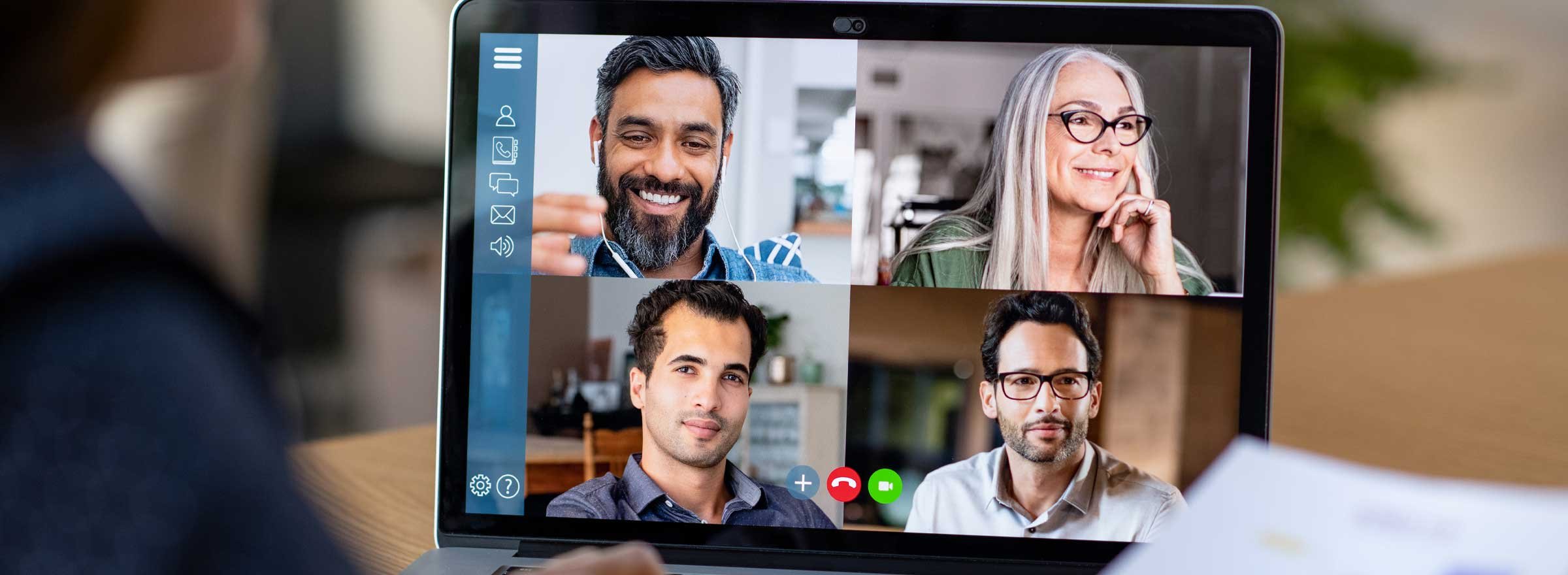 computer screen showing four people in a video conference