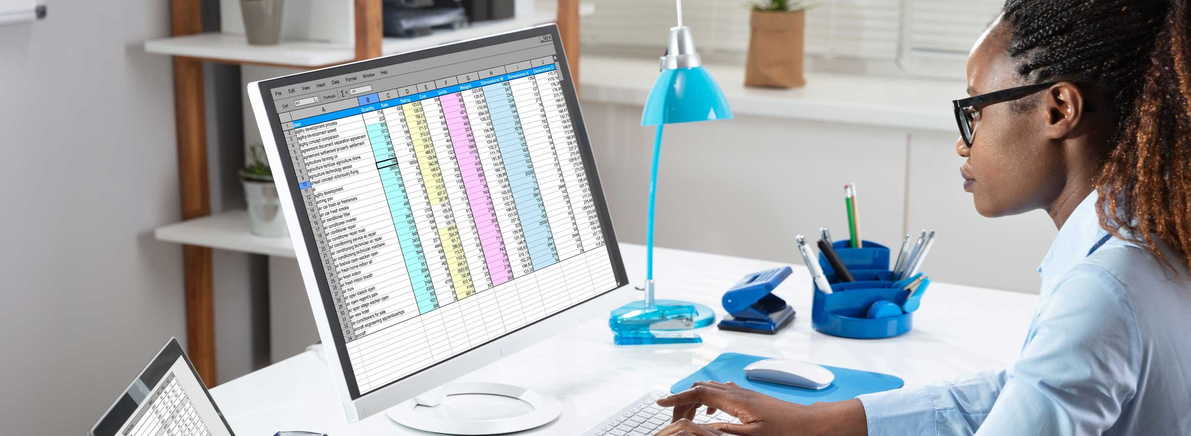 Woman working on a large spreadsheet