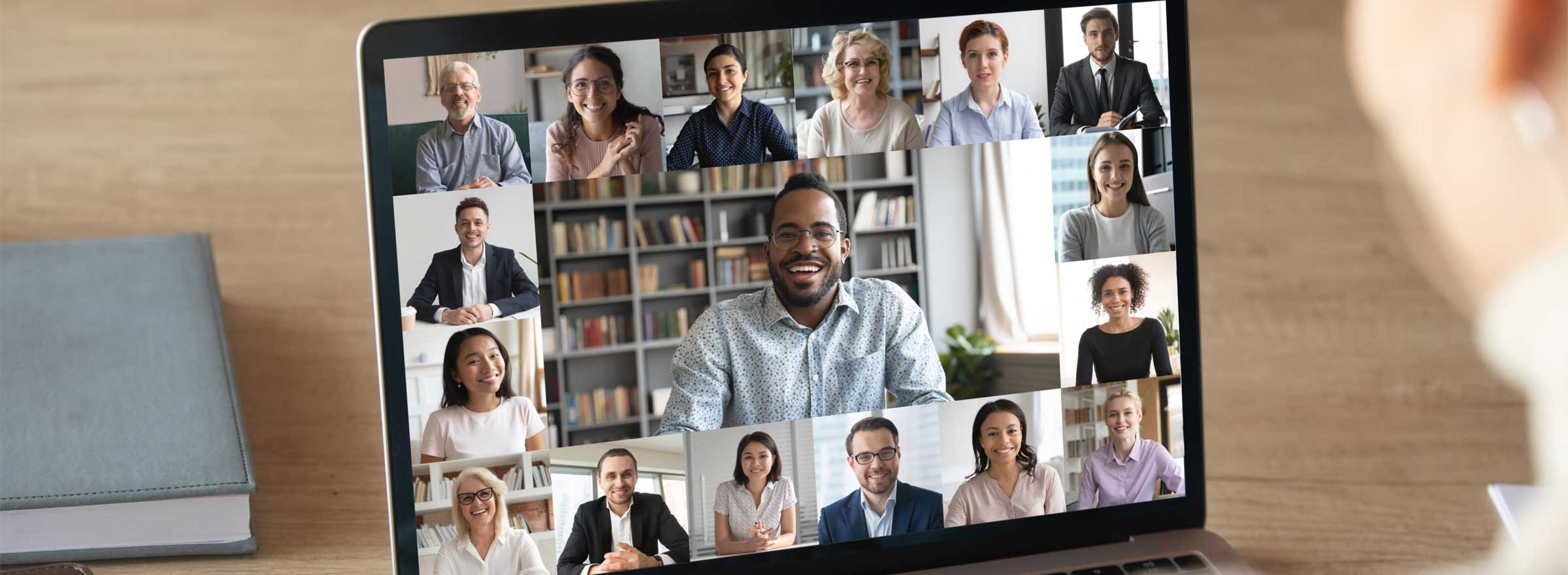 computer screen showing a video conference with a diverse group of people