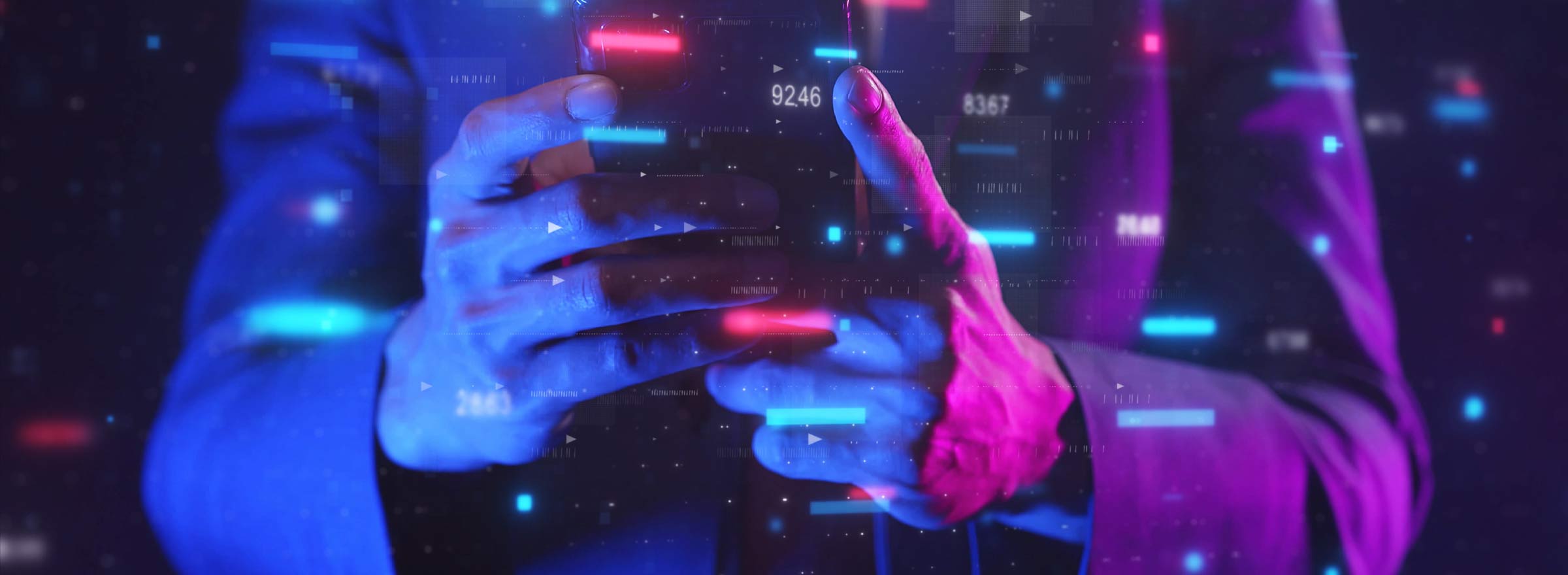 hands holding a device amid lots of colored lights