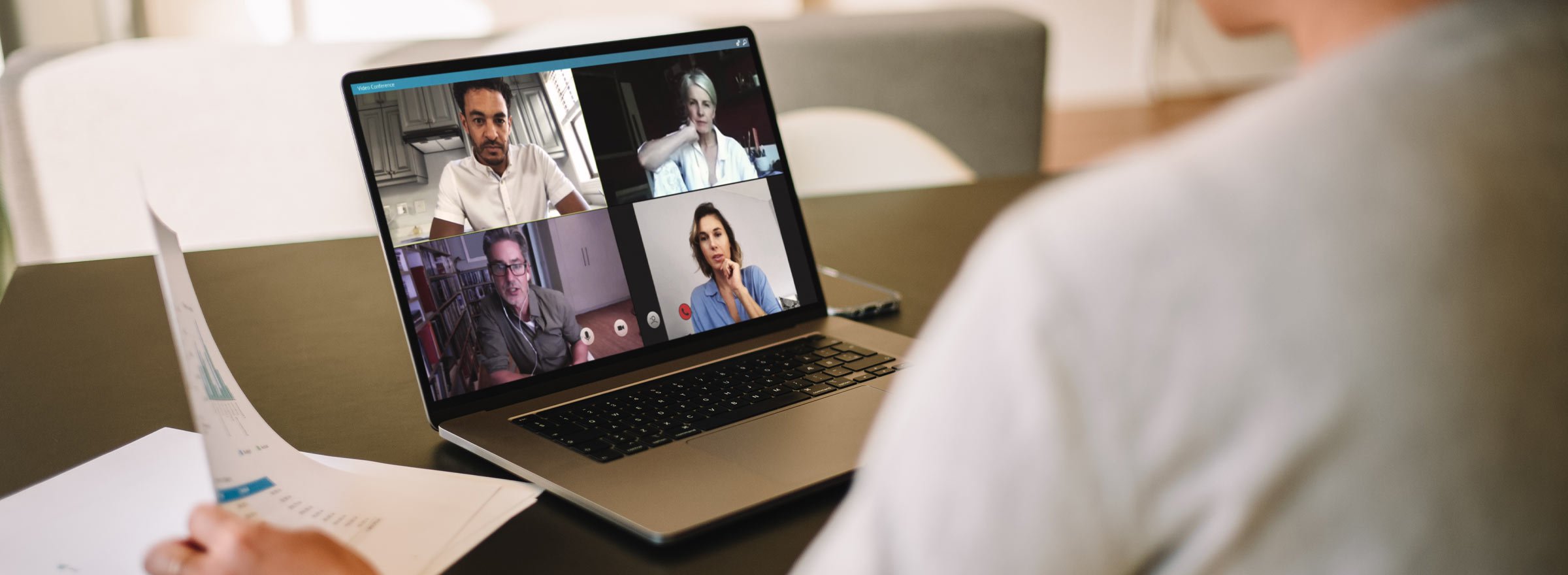 rear view of someone having a video conference with four people