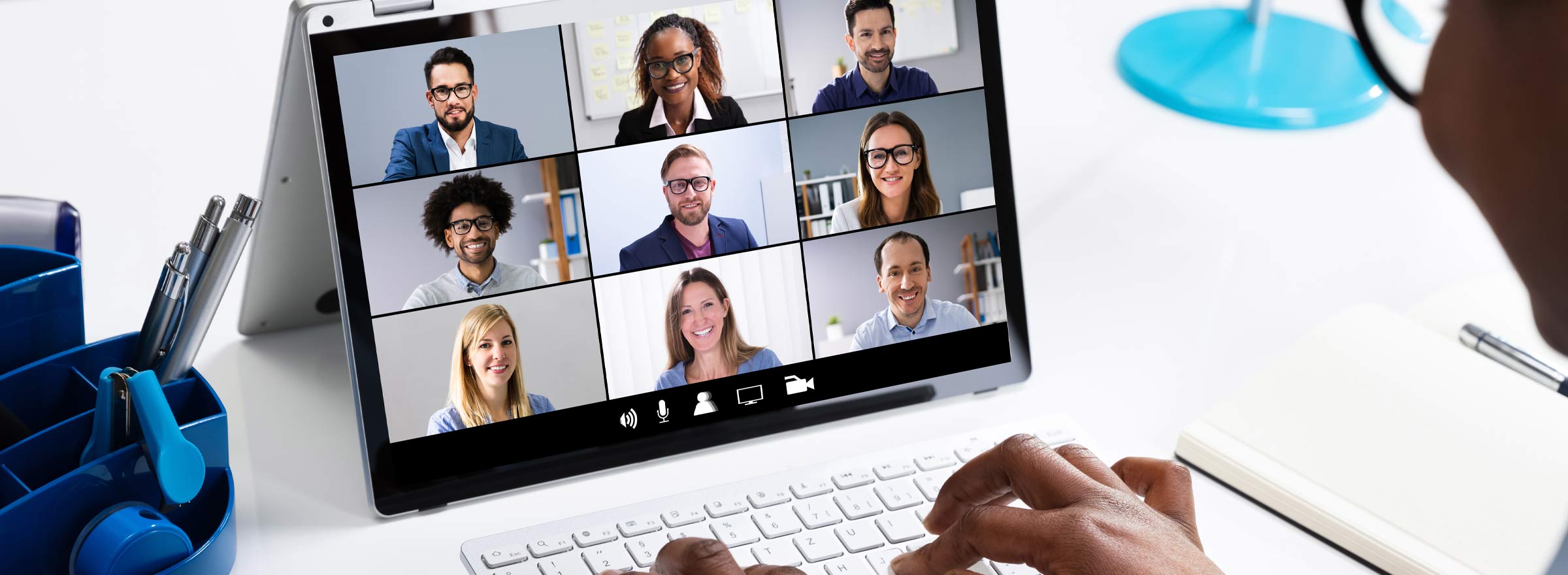 computer screen showing a nine-person video conference